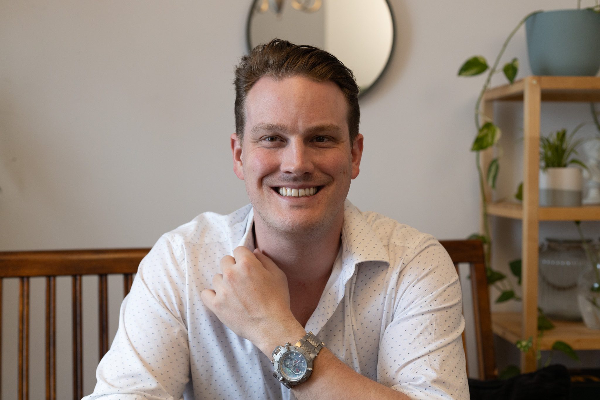 Bradley Collins, clarity coach for entrepreneurs, smiling in his Montréal office